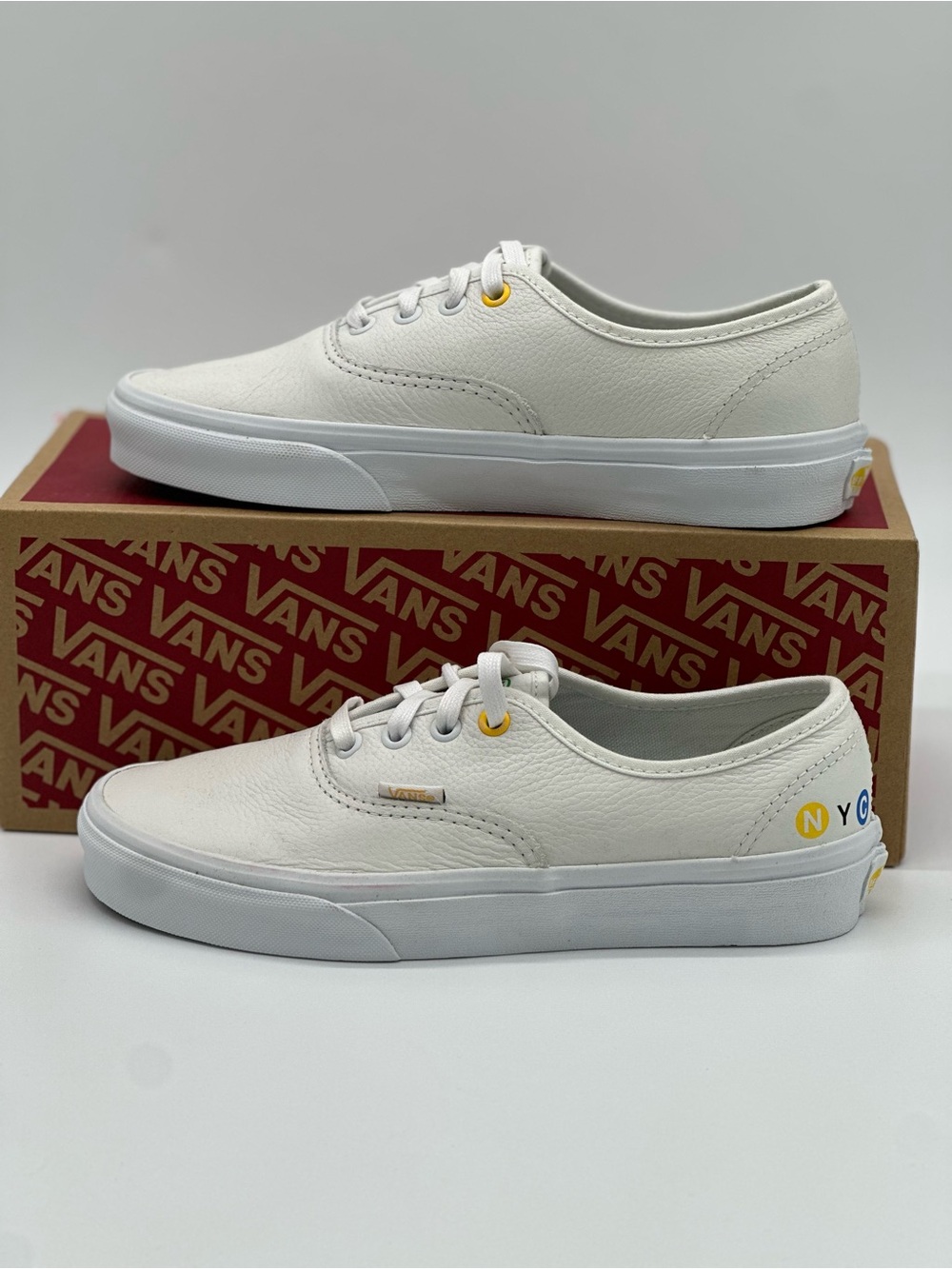 Vans White Low-Top Sneakers with Yellow Accent
